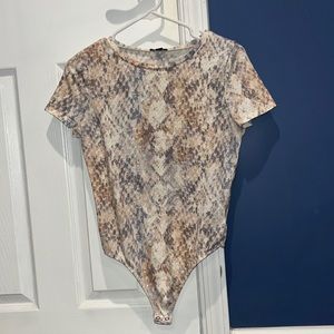 Snakeskin print short sleeve body suit. NEVER WORN